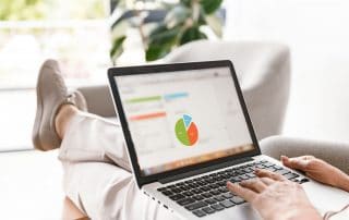 Close up of mature business woman working on laptop