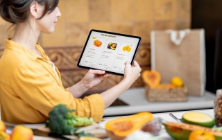 Woman shopping online using digital tablet