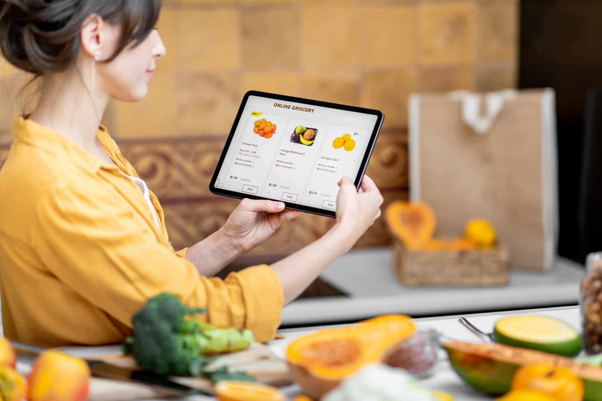 Woman shopping online using digital tablet